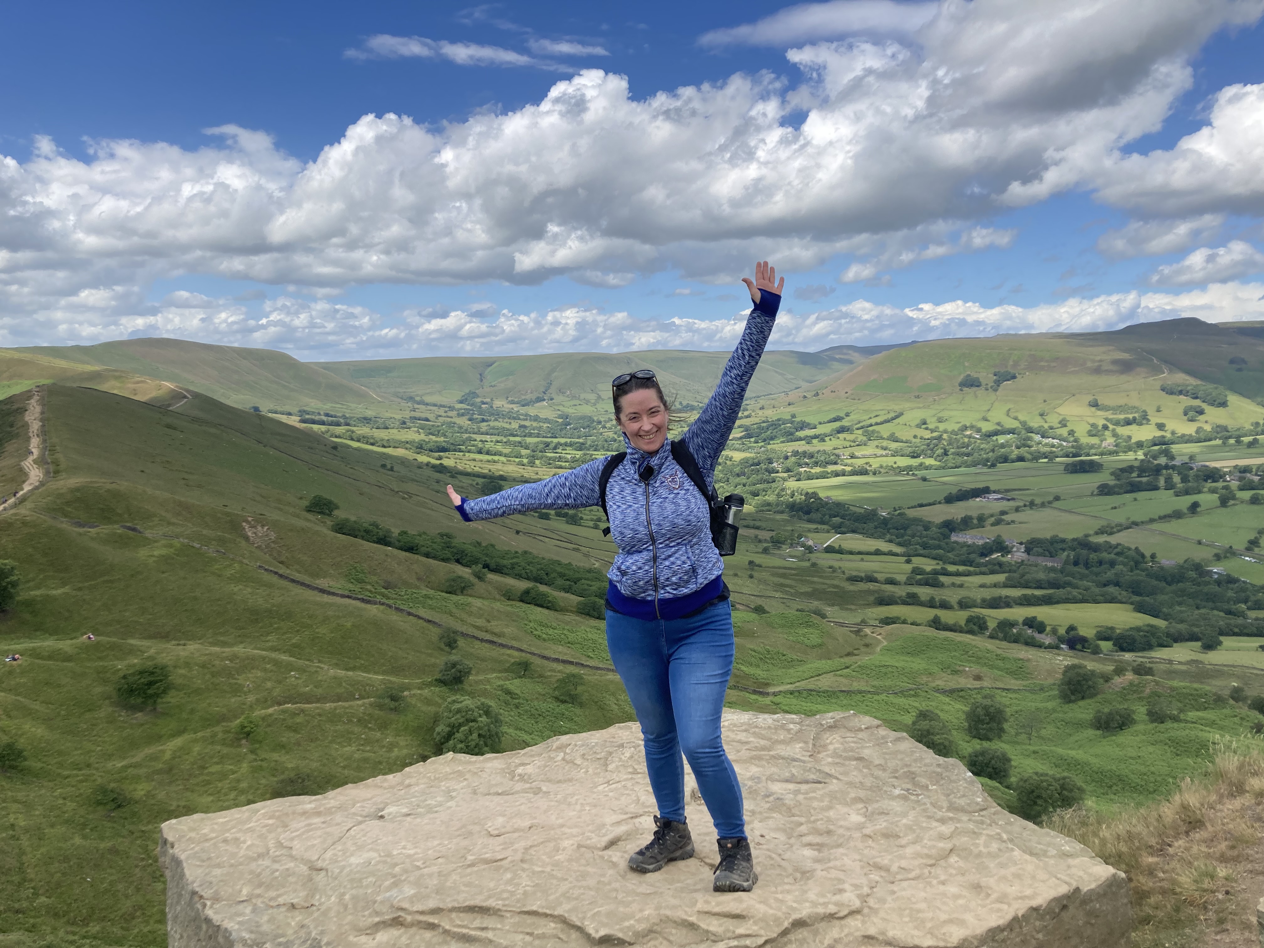 Photo of Cate standing on a hillside